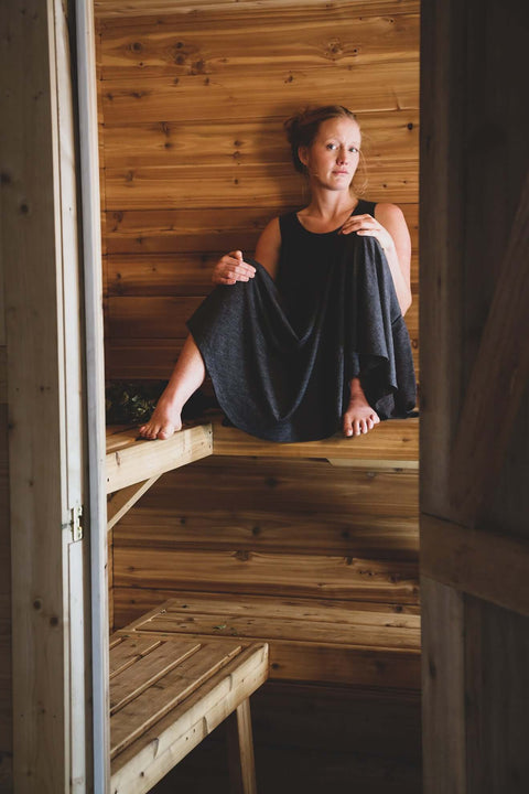 Woman in sauna wearing a merino wool dress