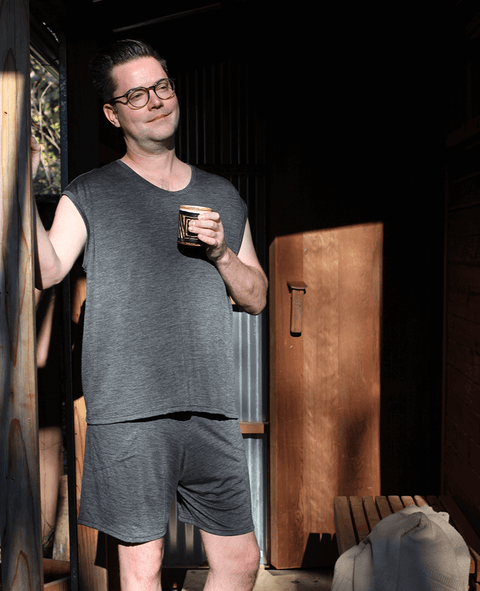 Man in sauna wearing merino wool shorts and top