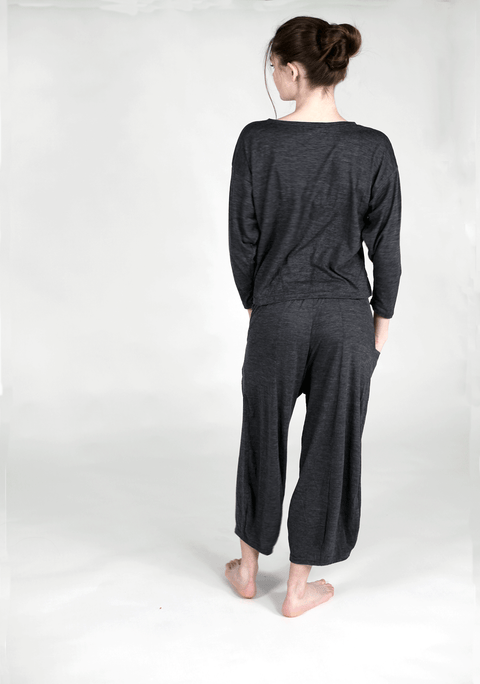 The back of a long sleeved lounge top made of 100% merino wool.